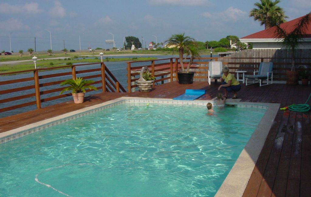 EXISTING WOOD DECK, CONCRETE STEPS and FLATWORK, HANDRAILS, BULKHEAD, STAIRS and POOL to be REPLACED